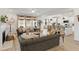 Open-concept living room showcasing a fireplace, hardwood floors, and a kitchen view at 4314 Grange Cir, Summerville, SC 29486