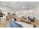 Open-concept living room featuring a kitchen island with bar seating and stylish, neutral furnishings at 4314 Grange Cir, Summerville, SC 29486