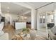 Open-concept living area with hardwood floors, sliding glass doors, and a view into the kitchen at 4314 Grange Cir, Summerville, SC 29486