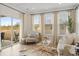 Cozy living room with large windows, neutral decor, and hardwood floors at 4314 Grange Cir, Summerville, SC 29486