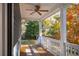 Relaxing back porch features a ceiling fan, railing, and views of the yard at 4524 Orr St, North Charleston, SC 29405