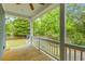 A cozy back porch with a ceiling fan overlooks a fenced yard at 4524 Orr St, North Charleston, SC 29405