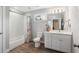Modern bathroom with subway tile shower and a white vanity at 4524 Orr St, North Charleston, SC 29405