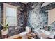 Charming half bathroom features a unique floral wallpaper, pedestal sink, and natural light at 4524 Orr St, North Charleston, SC 29405