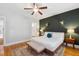 Comfortable bedroom with a dark accent wall and a view into the ensuite bathroom at 4524 Orr St, North Charleston, SC 29405