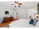 Bright bedroom featuring hardwood floors, natural light, and a view into the ensuite bathroom at 4524 Orr St, North Charleston, SC 29405