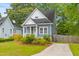 Charming blue two-story home with white trim, a cozy front porch, and a well-manicured front yard at 4524 Orr St, North Charleston, SC 29405