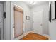 Bright hallway with hardwood floors and neutral paint, offering a clean and modern aesthetic at 4524 Orr St, North Charleston, SC 29405