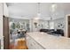 Spacious kitchen island offers a large countertop and a view into the dining and living areas at 4524 Orr St, North Charleston, SC 29405