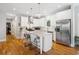 Bright kitchen features a large island, stainless steel appliances, and pendant lighting at 4524 Orr St, North Charleston, SC 29405