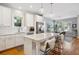 Open kitchen with island, stainless appliances, and a view into the dining and living areas at 4524 Orr St, North Charleston, SC 29405