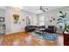 Bright living room features hardwood floors, neutral walls, stylish furniture, and ample natural light from windows at 4524 Orr St, North Charleston, SC 29405