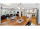 Open concept living space with hardwood floors, modern furnishings, dining area, and ample natural light at 4524 Orr St, North Charleston, SC 29405
