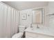 Clean bathroom with a shower, toilet, and vanity with white marble countertop at 4856 Green Dolphin Way # Share 7, Kiawah Island, SC 29455