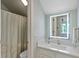 Bright bathroom with modern vanity, a lighted mirror, and shower-tub combination at 4856 Green Dolphin Way # Share 7, Kiawah Island, SC 29455