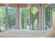 Bright bedroom with large windows offering views of lush greenery at 4856 Green Dolphin Way # Share 7, Kiawah Island, SC 29455