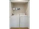 Convenient laundry room equipped with a washer, dryer, and shelving for storage at 4856 Green Dolphin Way # Share 7, Kiawah Island, SC 29455