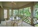 Screened-in patio with a round table and chairs, perfect for outdoor dining at 4856 Green Dolphin Way # Share 7, Kiawah Island, SC 29455