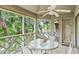 Relaxing screened porch with seating and view of the trees and landscape at 4856 Green Dolphin Way # Share 7, Kiawah Island, SC 29455