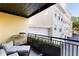 Relaxing balcony space with outdoor seating, planting boxes, and neighborhood views at 498 Albemarle Rd # 207, Charleston, SC 29407
