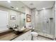 Beautiful bathroom with stone counters, an ornate vessel sink, and a luxurious glass shower at 498 Albemarle Rd # 207, Charleston, SC 29407