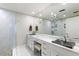 Modern bathroom with marble counters, uniquely shaped vessel sinks, and luxurious glass shower at 498 Albemarle Rd # 207, Charleston, SC 29407