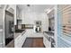 Modern kitchen featuring stainless steel appliances, a gray countertop, and white cabinets at 498 Albemarle Rd # 207, Charleston, SC 29407