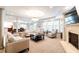 Inviting living room features fireplace, neutral color palette, and lots of light at 498 Albemarle Rd # 207, Charleston, SC 29407