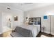 Bedroom featuring a comfortable bed, hardwood floors, and an en suite bathroom at 498 Albemarle Rd # 207, Charleston, SC 29407