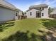 Expansive backyard featuring a green lawn, fence and a screened-in porch, ideal for gatherings at 529 Delafield Dr # 529, Summerville, SC 29483
