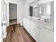 Bright bathroom featuring a double vanity, large mirror, and separate tub and shower at 529 Delafield Dr # 529, Summerville, SC 29483