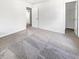 An empty bedroom with gray carpet and natural light coming in from the open doorways at 529 Delafield Dr # 529, Summerville, SC 29483