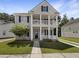 Charming two-story home with a welcoming double porch and manicured lawn, perfect for enjoying the outdoors at 529 Delafield Dr # 529, Summerville, SC 29483