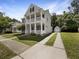 Inviting two-story home featuring a long driveway leading to a detached garage, complemented by a well-maintained lawn at 529 Delafield Dr # 529, Summerville, SC 29483