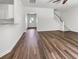 Bright and airy living space with hardwood floors, offering a seamless transition to the entryway and staircase at 529 Delafield Dr # 529, Summerville, SC 29483