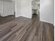 Shows hardwood floors, an entryways to a kitchen and bedroom, and natural light in empty space at 529 Delafield Dr # 529, Summerville, SC 29483