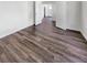 An empty living room shows hardwood floors and entryways that lead to the rest of the house at 529 Delafield Dr # 529, Summerville, SC 29483