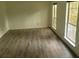 Cozy bedroom with hardwood floors and natural light from two large windows at 638 Leisure Ln, Mount Pleasant, SC 29464
