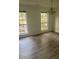 Dining room features hardwood floors, two windows, and an attractive chandelier at 638 Leisure Ln, Mount Pleasant, SC 29464