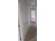 Bright hallway with neutral carpet and fresh white doors leading to various rooms of the house at 638 Leisure Ln, Mount Pleasant, SC 29464