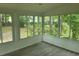 Sun room surrounded by large windows providing plenty of natural light and views of the backyard at 638 Leisure Ln, Mount Pleasant, SC 29464
