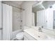 Bright bathroom featuring a shower-tub combination, white tiled walls, and modern fixtures at 754 Certificate Ct, Charleston, SC 29414