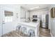 Well-lit kitchen featuring stainless steel appliances, an island, and seating at 754 Certificate Ct, Charleston, SC 29414