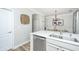 Modern kitchen with stainless steel appliances, white cabinets, and a dining area at 754 Certificate Ct, Charleston, SC 29414