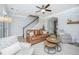 Cozy living room with a leather sofa, patterned chairs, and a stylish rug at 754 Certificate Ct, Charleston, SC 29414