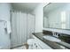 Bathroom featuring a granite countertop, mirror, shower with patterned curtain, and neutral paint at 78 Branch Creek Trl, Summerville, SC 29483