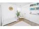 Bright Bedroom with neutral accents, a white crib, white glider, and books on the wall at 78 Branch Creek Trl, Summerville, SC 29483