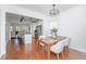 Bright dining room featuring hardwood floors and modern décor that opens up to the kitchen at 78 Branch Creek Trl, Summerville, SC 29483