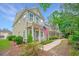 Inviting home exterior with patriotic decor, lush landscaping, and a charming walkway at 78 Branch Creek Trl, Summerville, SC 29483