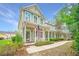 Charming two-story home with a welcoming front porch and American flag, nestled in a friendly neighborhood at 78 Branch Creek Trl, Summerville, SC 29483